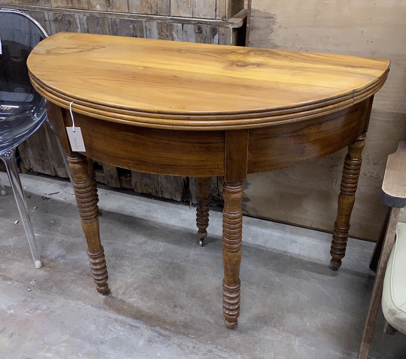 A 19th century French cherry 'D' shaped folding tea table, width 111cm, depth 55cm, height 79cm